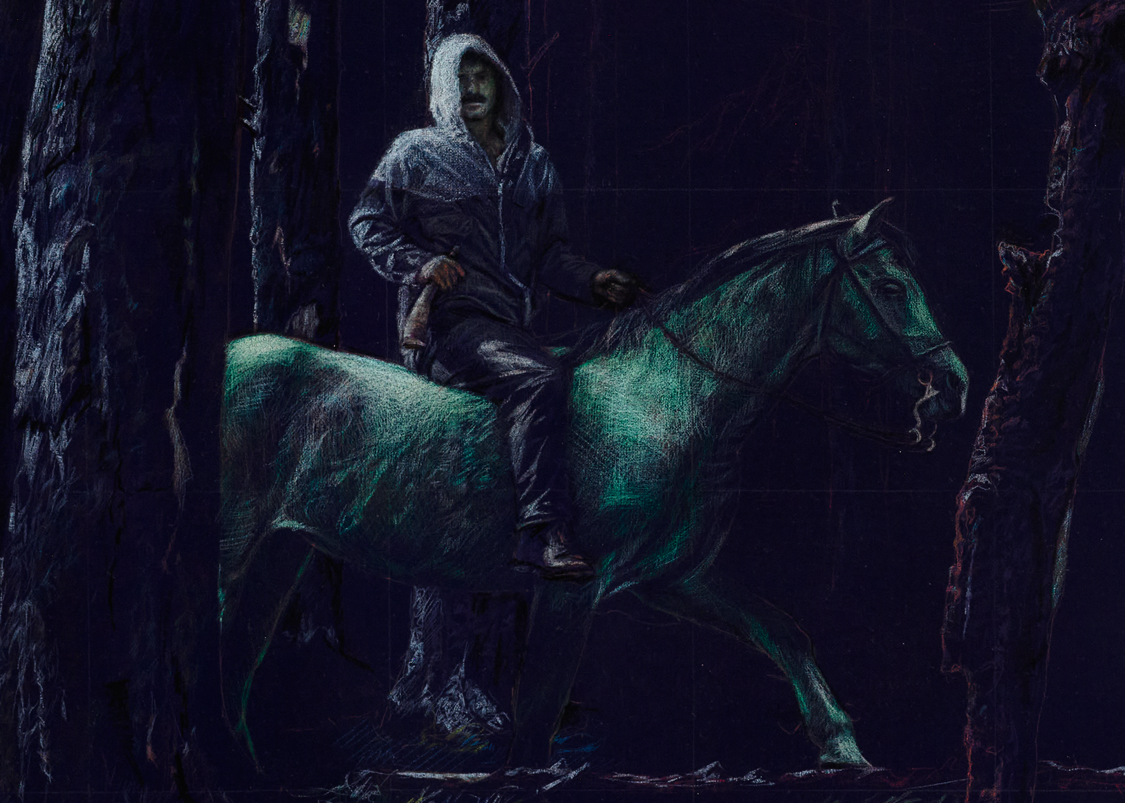 Man in a hoodie riding a horse